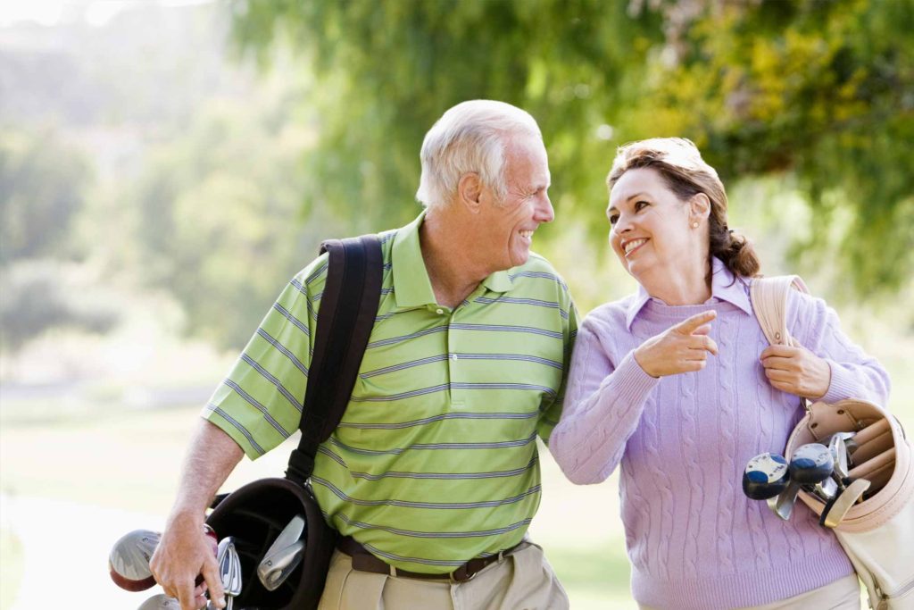 Photo of laughing couple walking