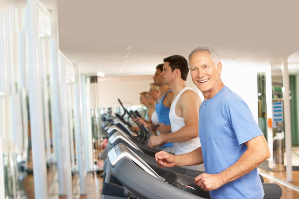 Photo of smiling man on treadmill